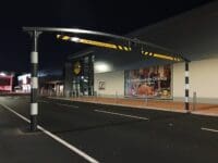 Elegant bespoke curved height restrictor for effective height regulation in parking and roadways