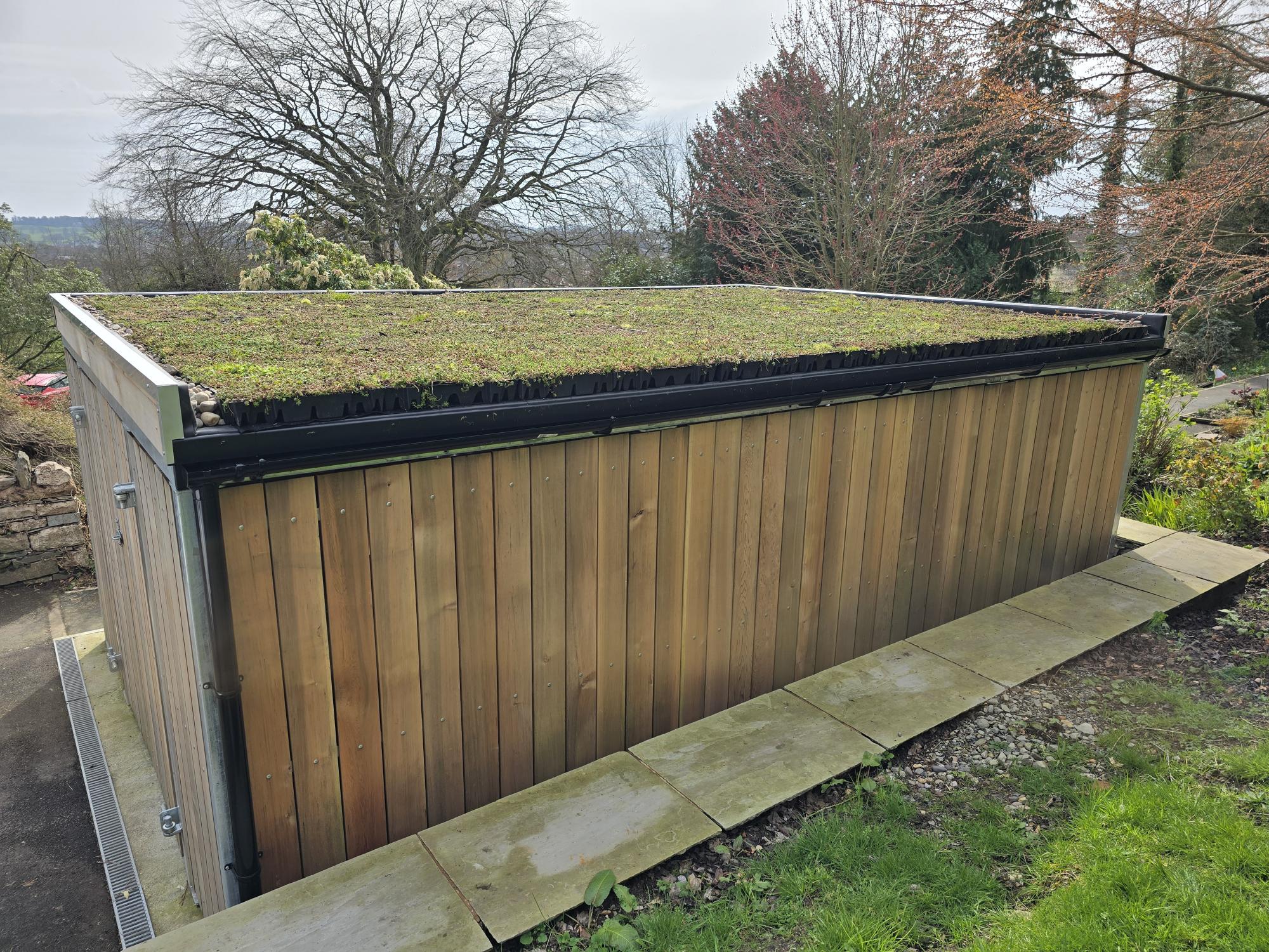 Timber and metal bin store solution with sedum roof