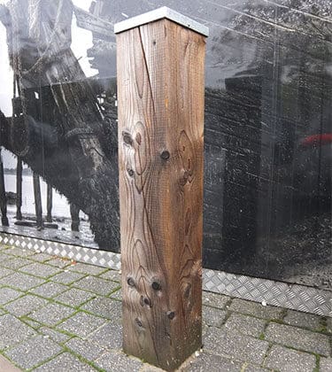 Softwood bollard with metal cap